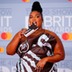 Lizzo poses on the red carpet on arrival for the BRIT Awards 2020 in London on February 18, 2020.